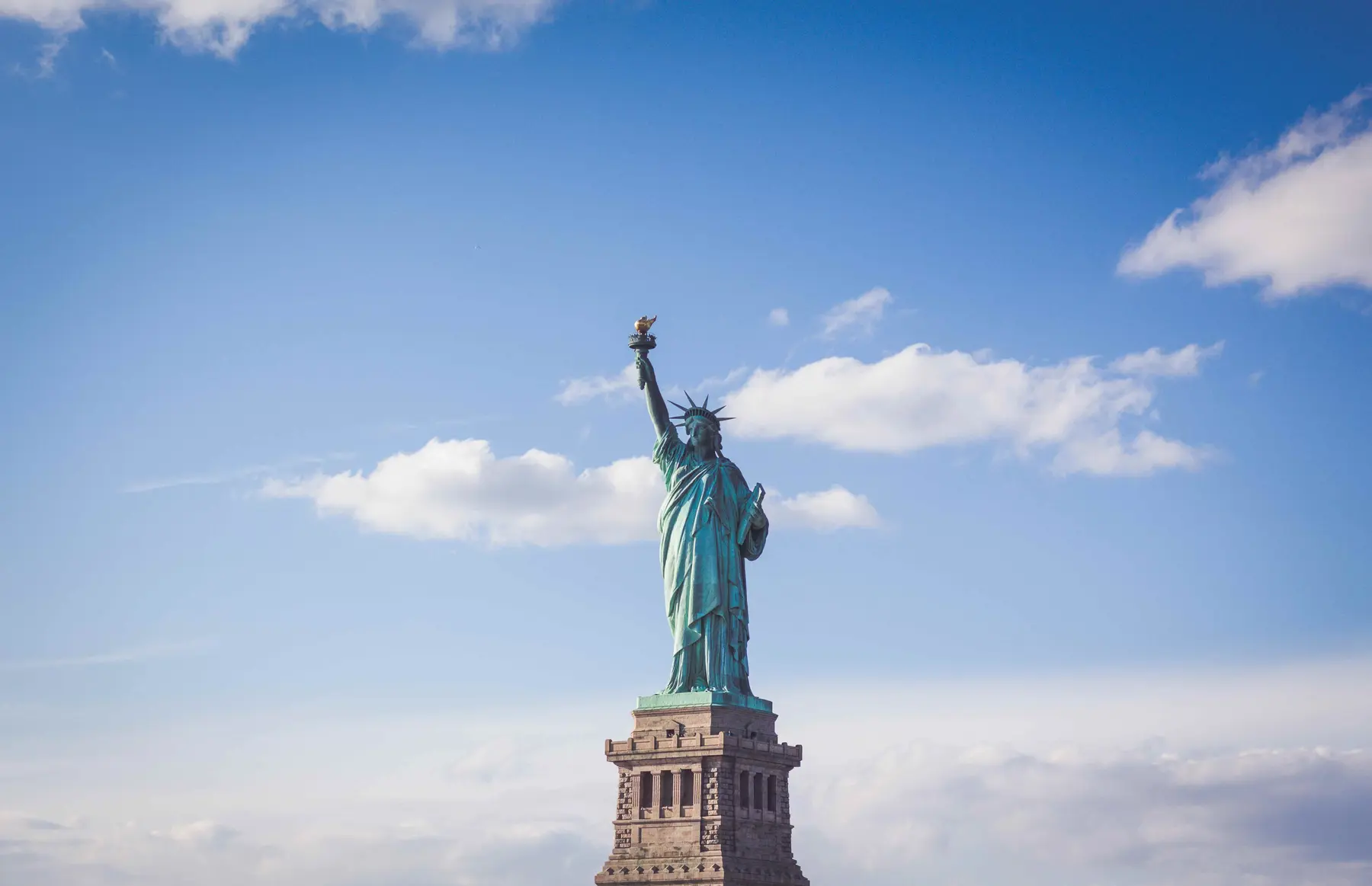 The Statue of Liberty under a clear blue sky
